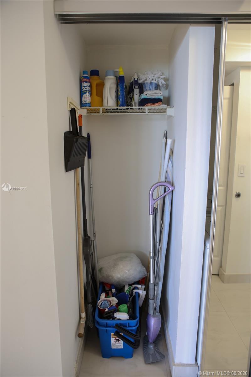 9455 Collins Avenue, Unit 707 Surfside, FL 33154 - Photo 13 of 60 a view of storage and utility room with racks on the wall