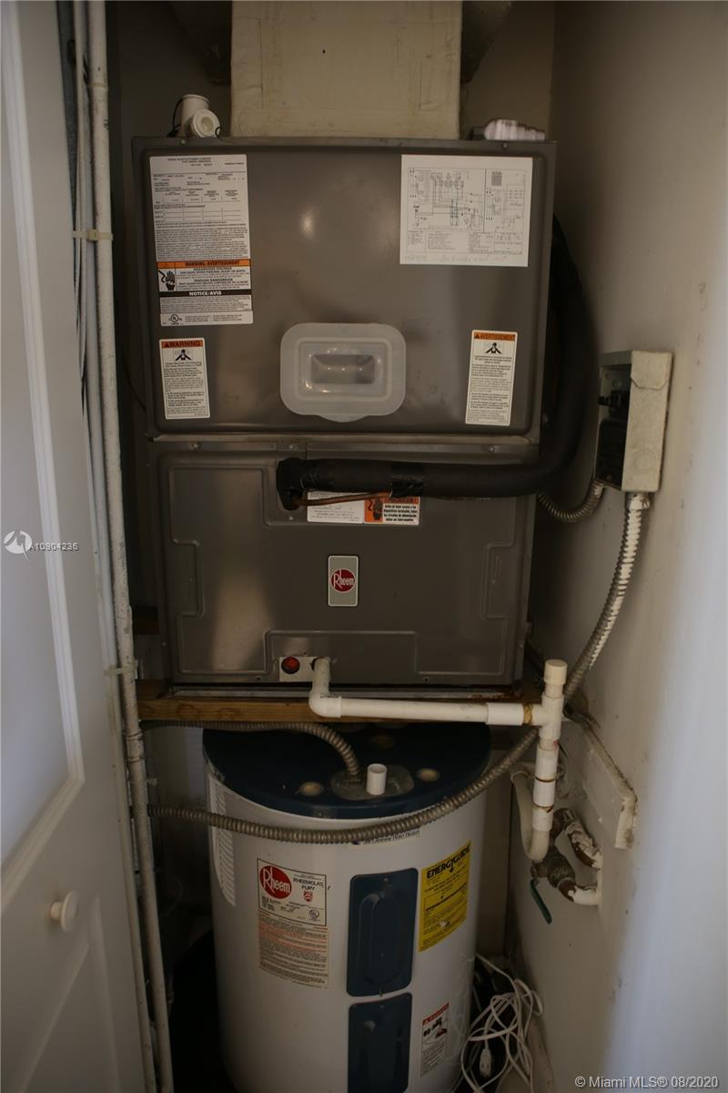 9455 Collins Avenue, Unit 707 Surfside, FL 33154 - Photo 14 of 60 a close view of water heater