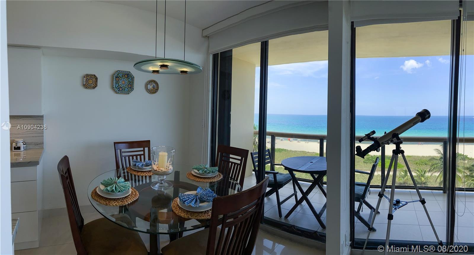 9455 Collins Avenue, Unit 707 Surfside, FL 33154 - Photo 47 of 60 a view of a dining room with furniture and a window