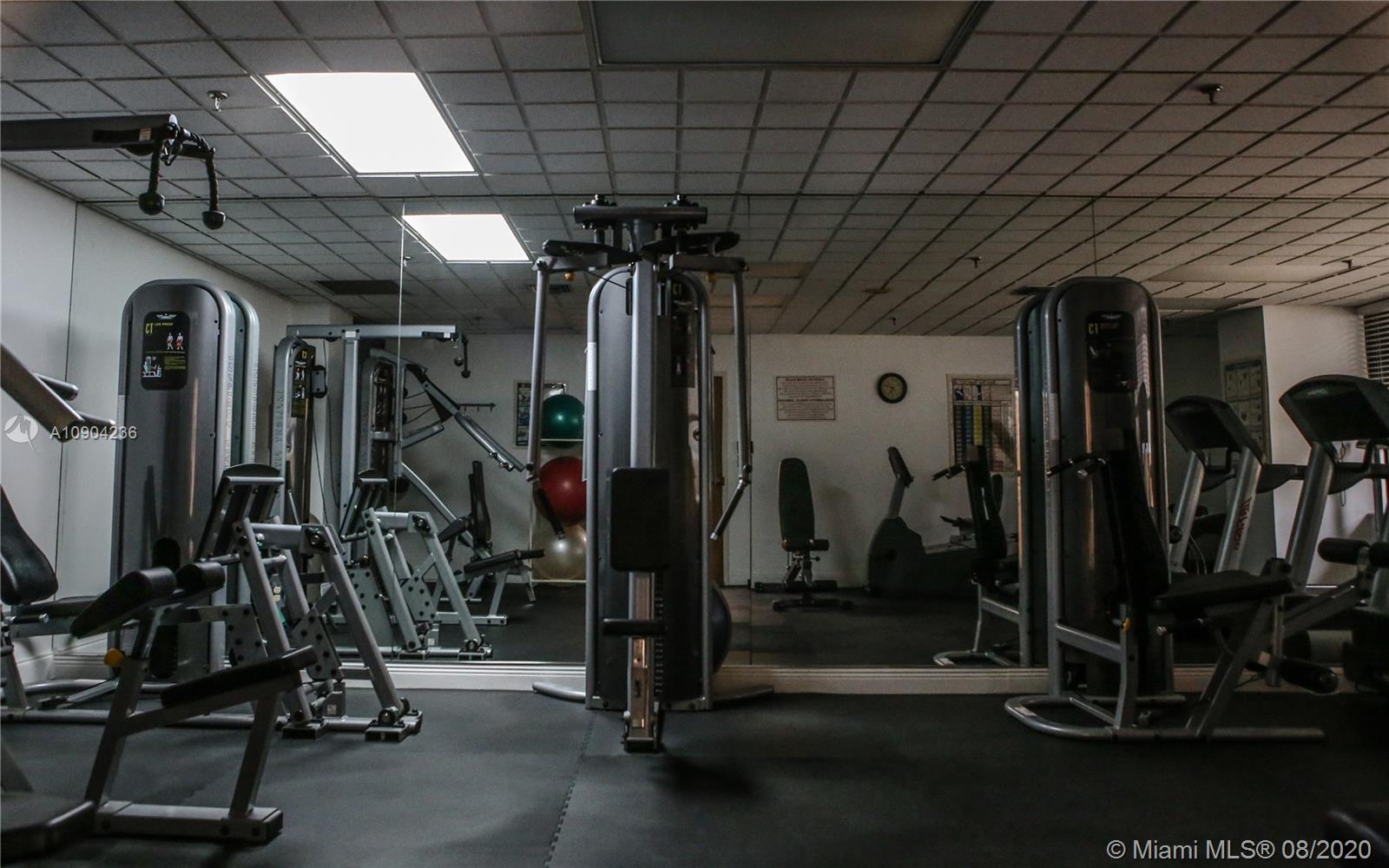 9455 Collins Avenue, Unit 707 Surfside, FL 33154 - Photo 59 of 60 a view of a room with gym equipment