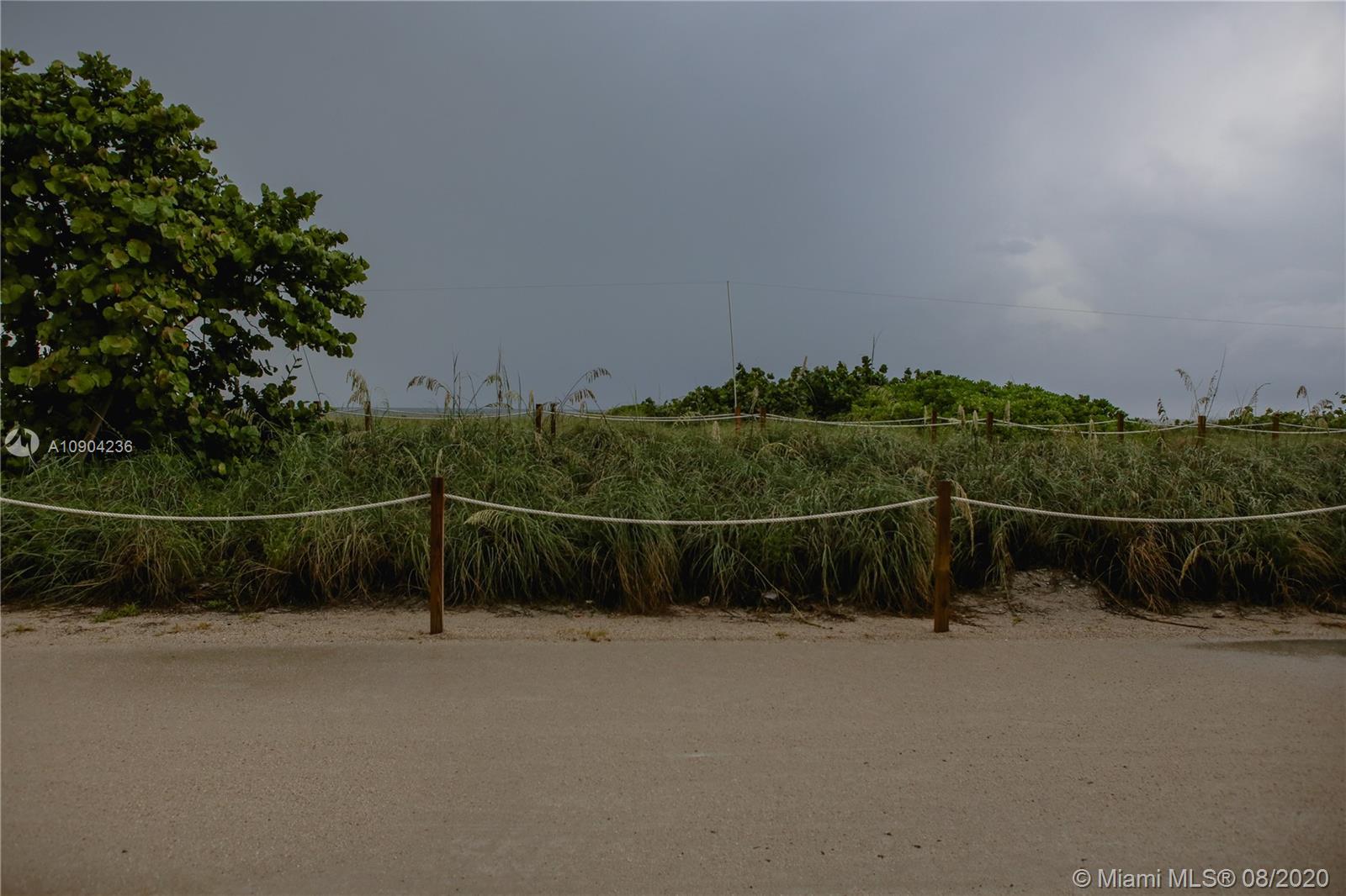 9455 Collins Avenue, Unit 707 Surfside, FL 33154 - Photo 7 of 60 a view of a field with wooden fence