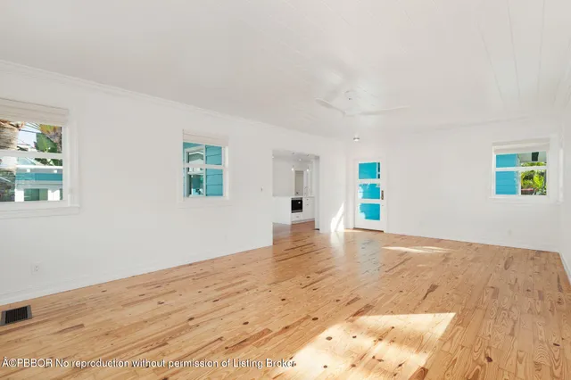 a living room with furniture rug and window