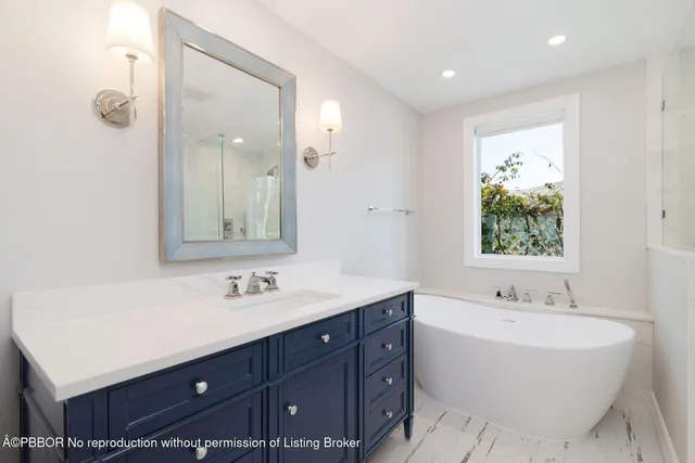 a bedroom with a bed and a table