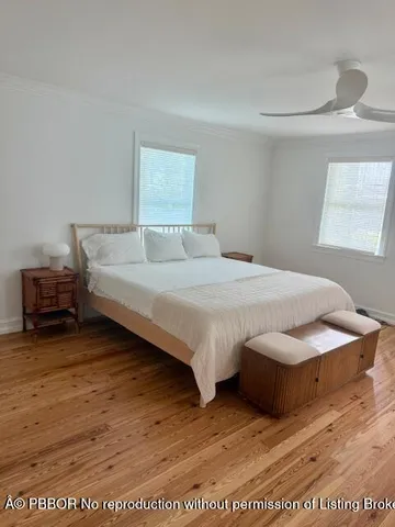 a bedroom with a bed and a night stand