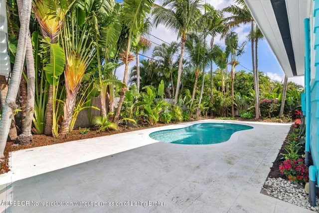 a kitchen with a stove window and chairs