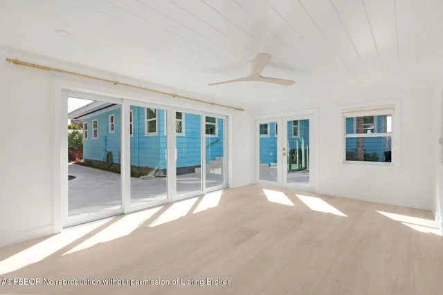 a bathroom with a shower a sink a mirror and a shower