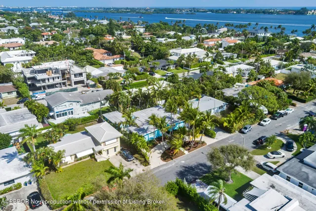 a front view of a house with garden and porch