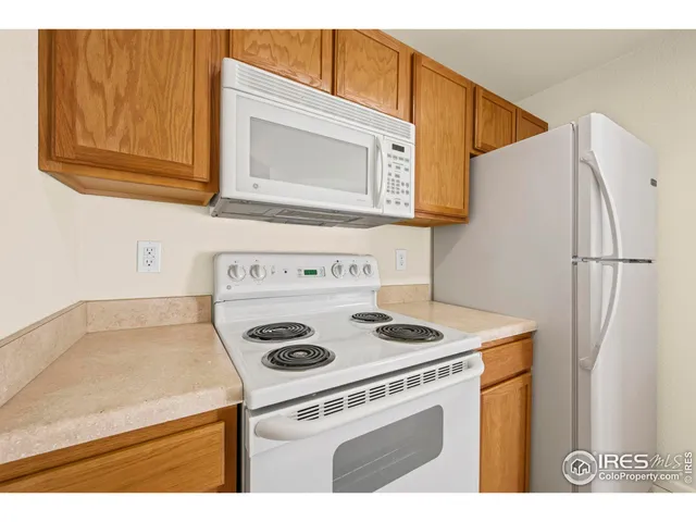 a kitchen with a sink and a refrigerator