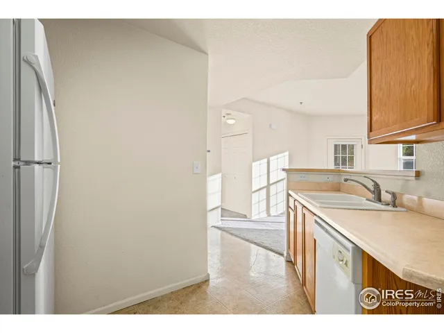 a view of a kitchen with wooden floor