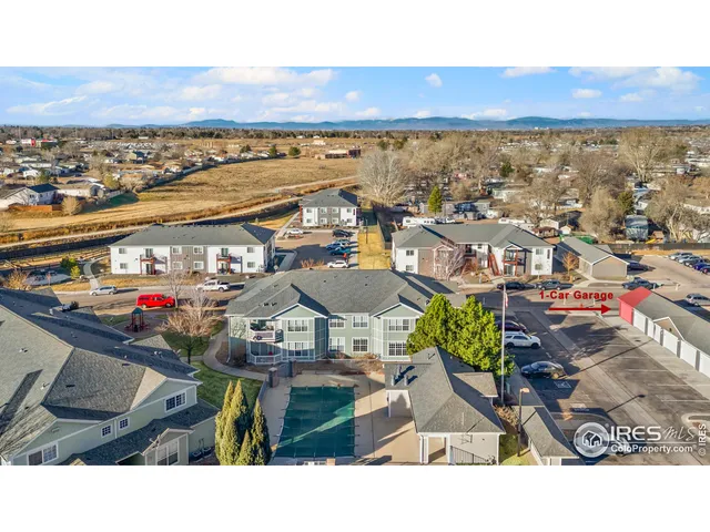 an aerial view of residential building and ocean view