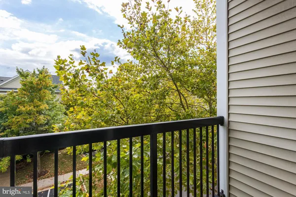 a view of a balcony with a tree