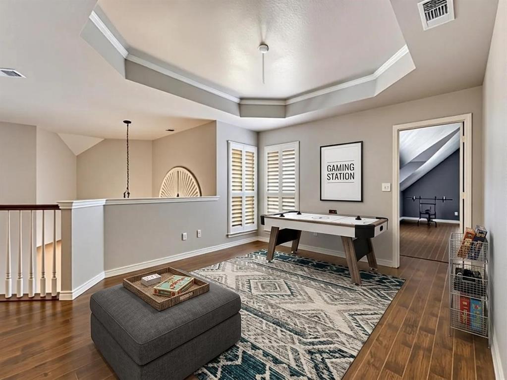 1714 Cross Point Road McKinney, TX 75072 - Photo 16 of 22 a living room with furniture and a wooden floor