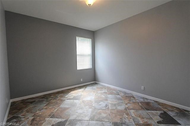 23351 Olde Meadowbrook Circle Estero, FL 34134 - Photo 16 of 25 a view of an empty room and window