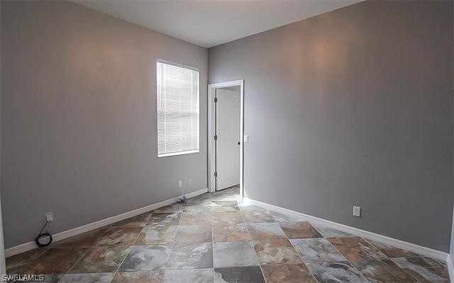 23351 Olde Meadowbrook Circle Estero, FL 34134 - Photo 18 of 25 a view of an empty room and window