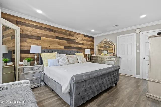 a bathroom with a toilet a sink a mirror and shower