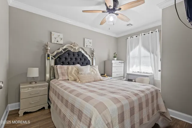 a kitchen with stainless steel appliances a refrigerator a stove a sink and chairs