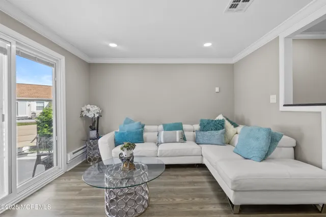 a view of a patio with a table and chairs