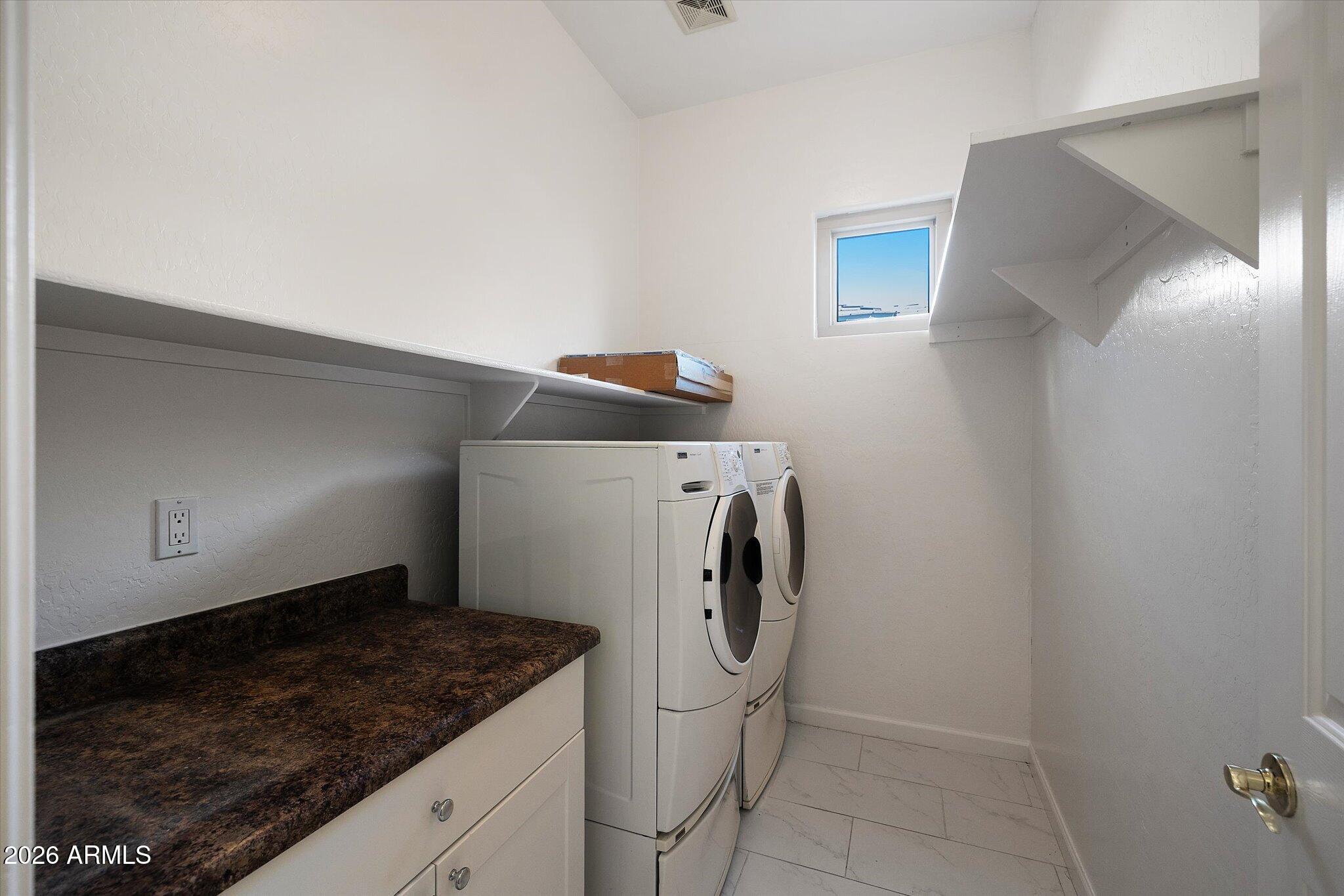 4018 East Harrison Street Gilbert, AZ 85295 - Photo 12 of 45 a utility room with dryer and washer