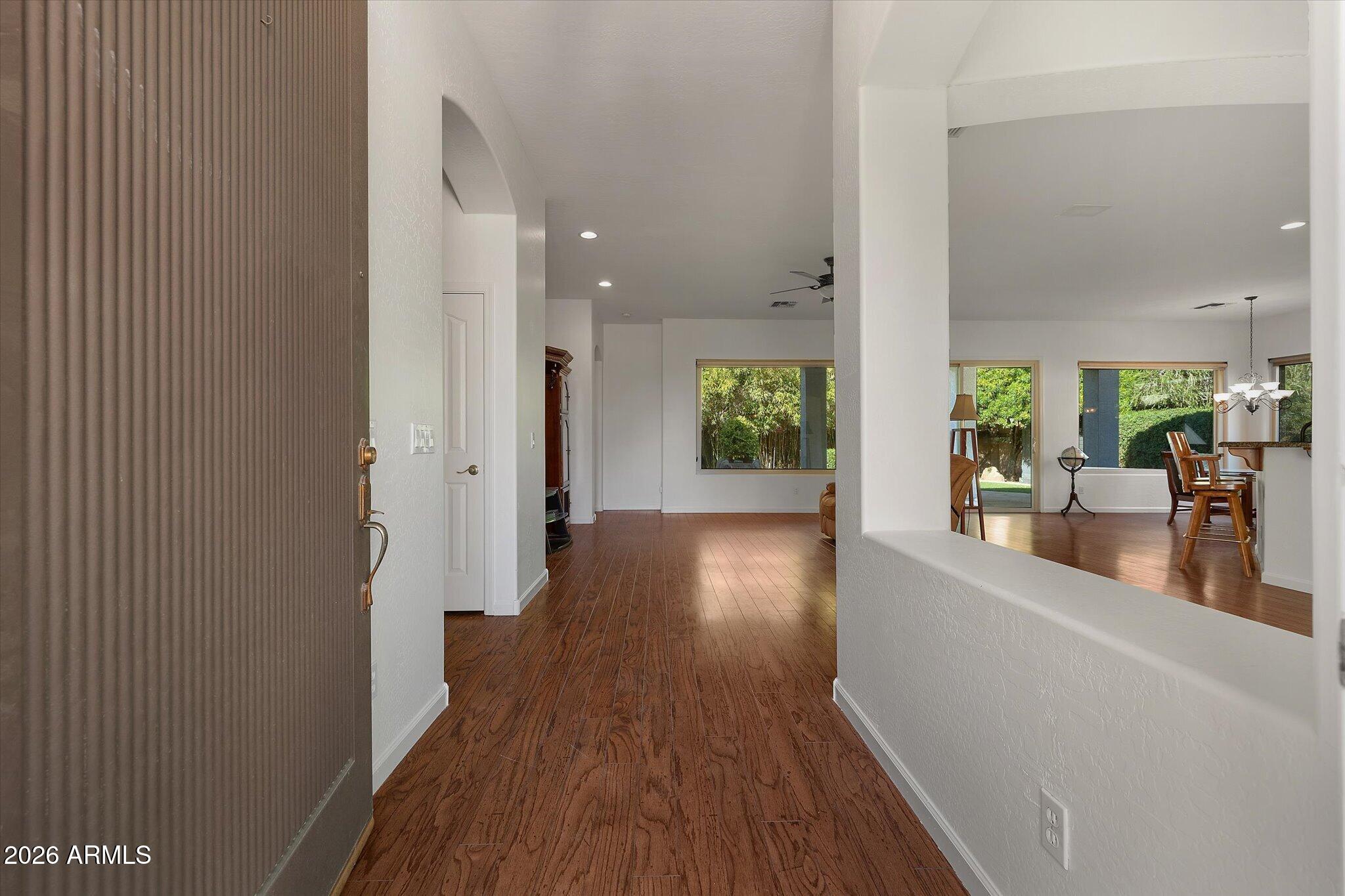 4018 East Harrison Street Gilbert, AZ 85295 - Photo 2 of 45 a view of a hallway view with wooden floor and a living room