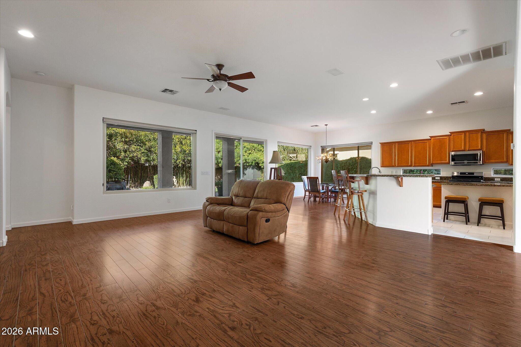 4018 East Harrison Street Gilbert, AZ 85295 - Photo 3 of 45 a living room with furniture and a wooden floor