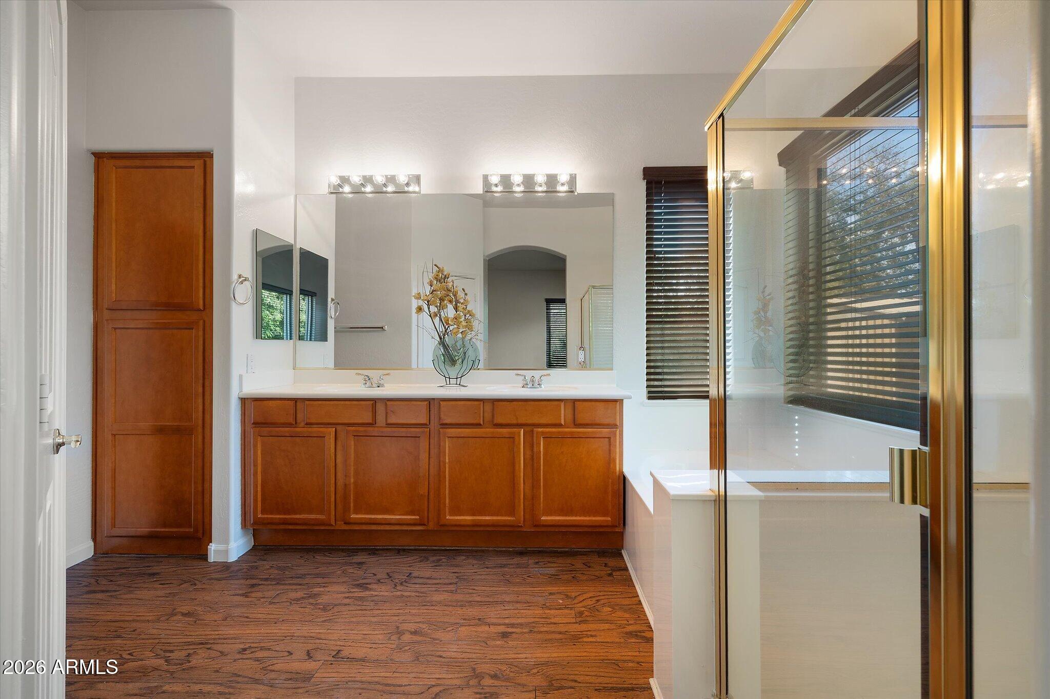 4018 East Harrison Street Gilbert, AZ 85295 - Photo 32 of 45 a bathroom with a mirror and a sink