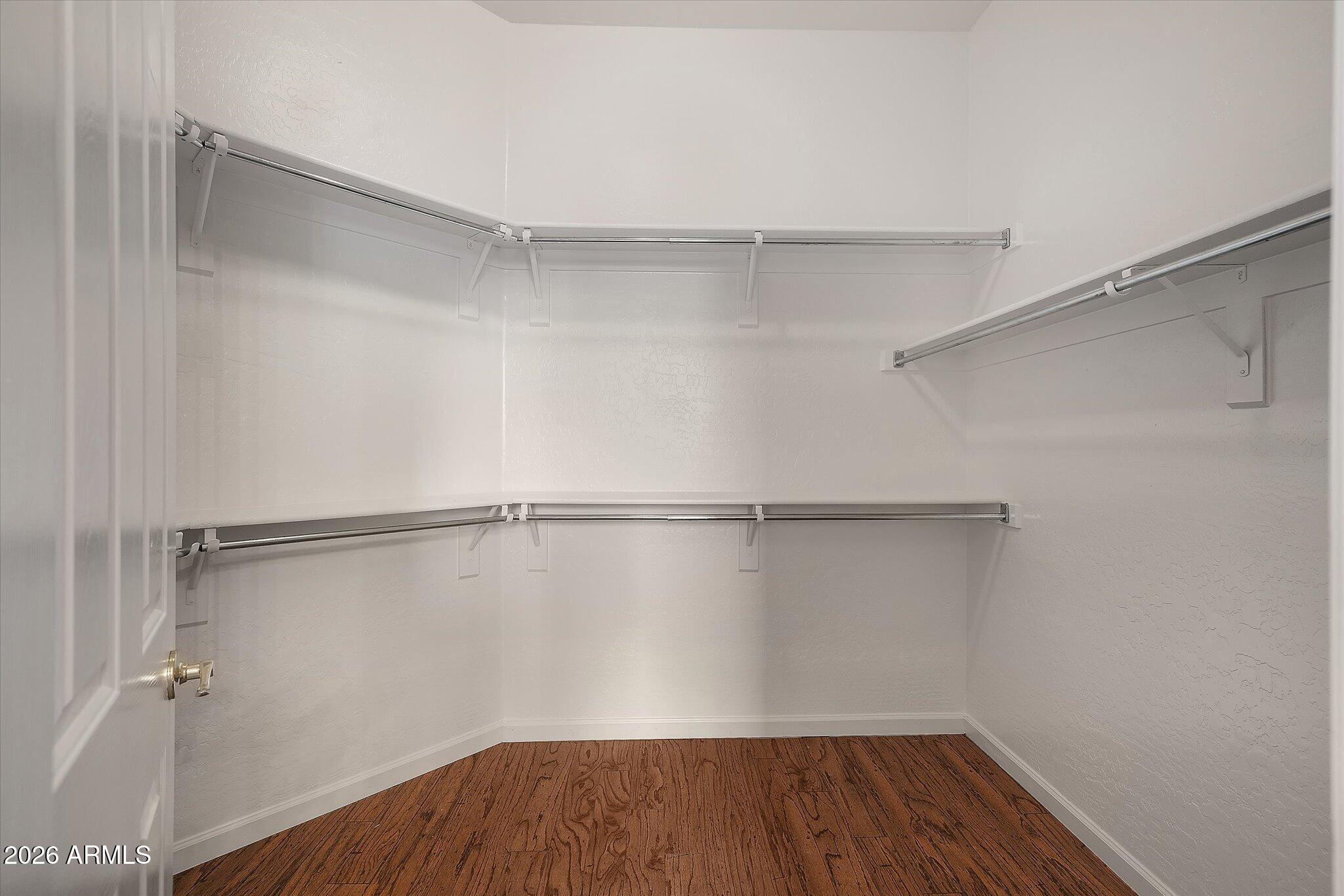 4018 East Harrison Street Gilbert, AZ 85295 - Photo 34 of 45 a view of walk in closet with empty racks