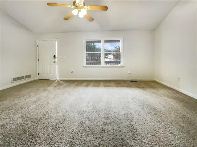 an empty room with a empty space and window