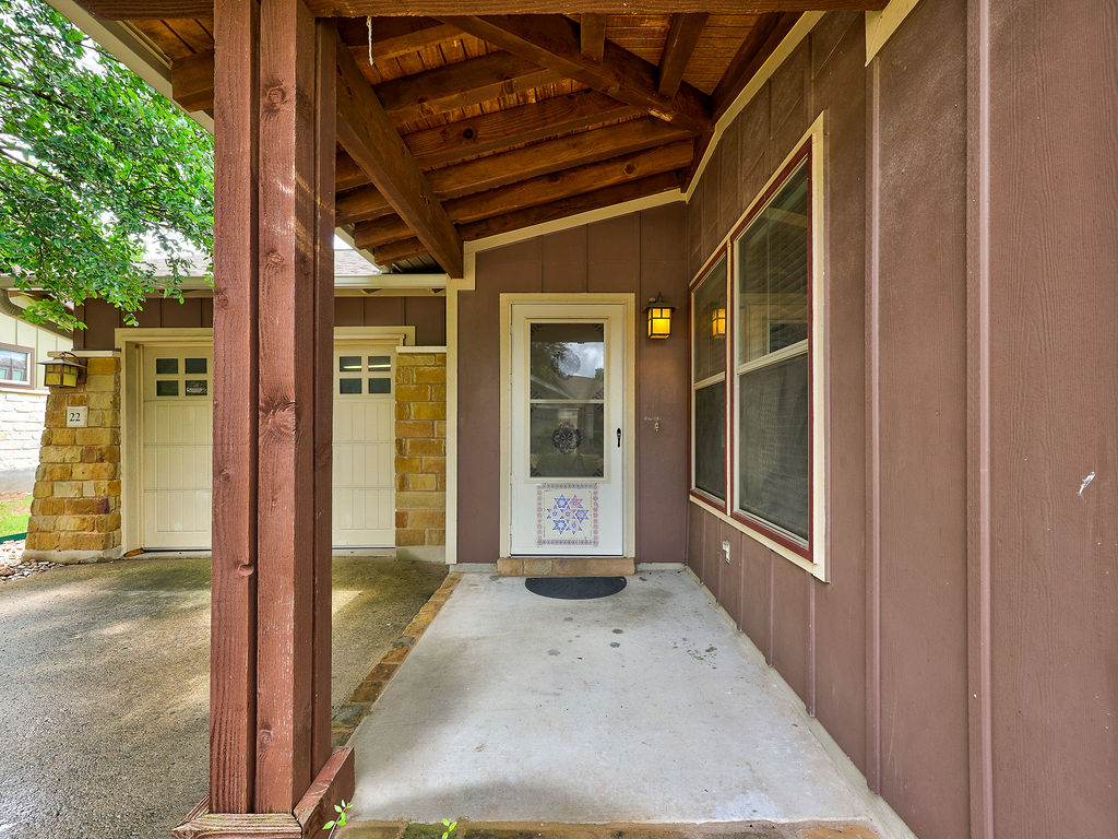 9707 Anderson Mill Road, Unit 22 Austin, TX 78750 - Photo 4 of 39 A covered porch welcomes you to this charming residence with a sturdy wood beam ceiling.