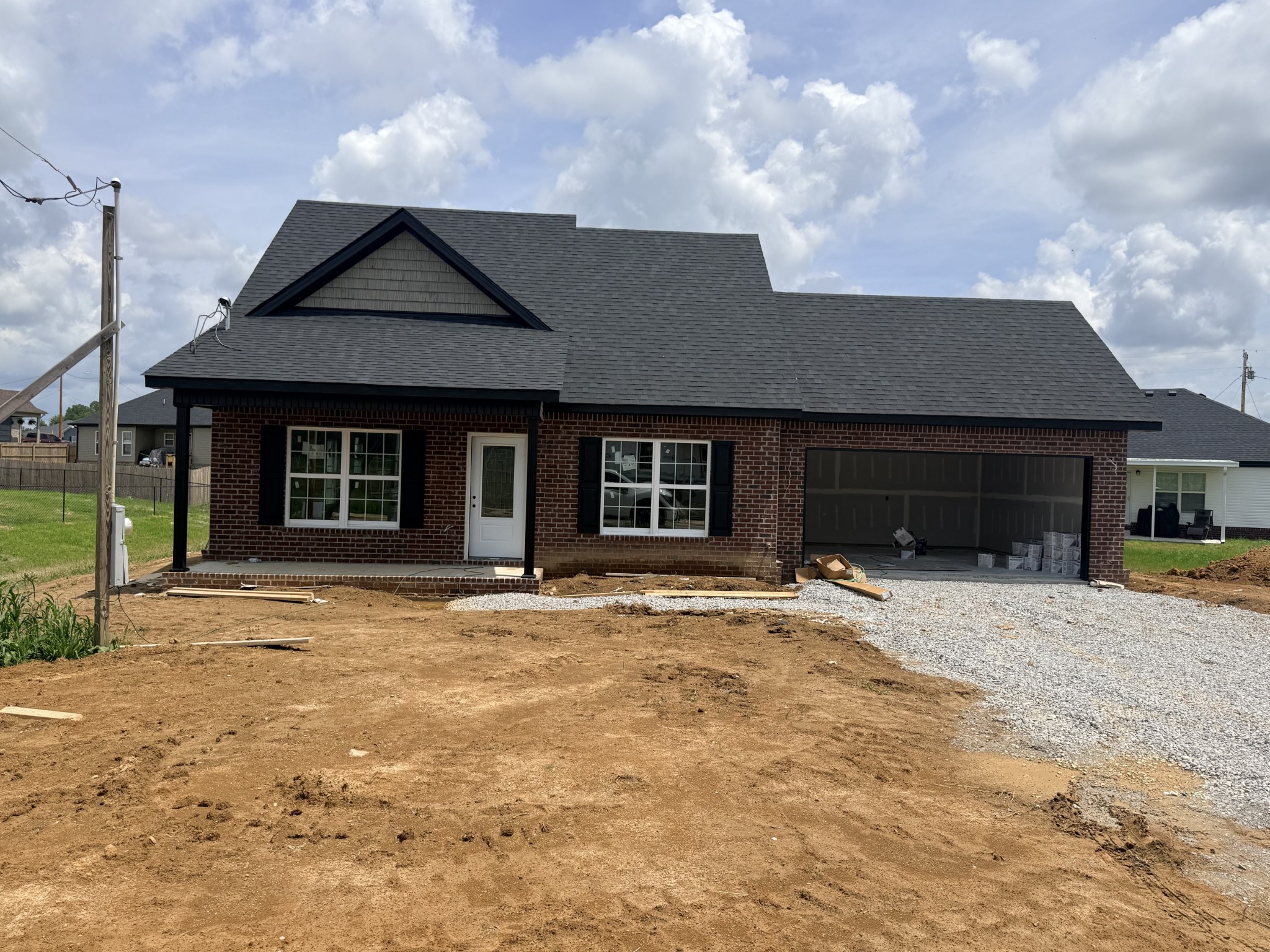 362 Ridge Street Manchester, TN 37355 - Photo 3 of 18 a front view of a house with a yard and garage