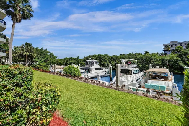 a view of a garden with lawn chairs