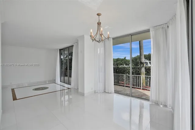 a kitchen with granite countertop a sink and cabinets
