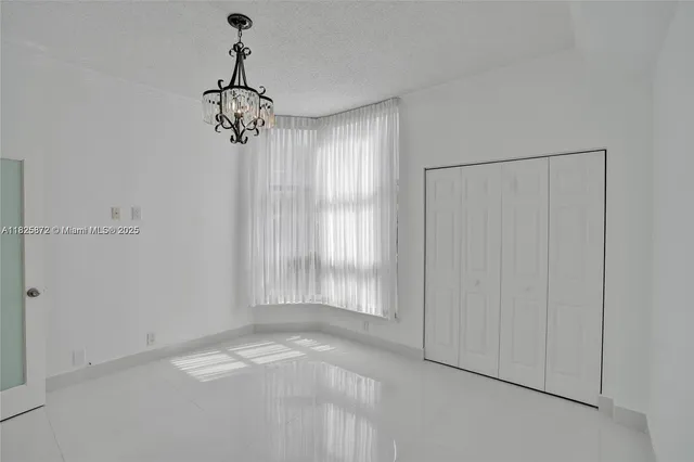 a bathroom with a tub shower sink and vanity