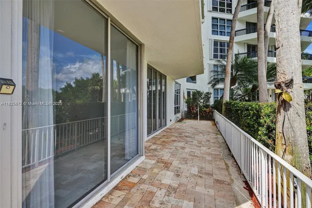 a view of balcony with furniture