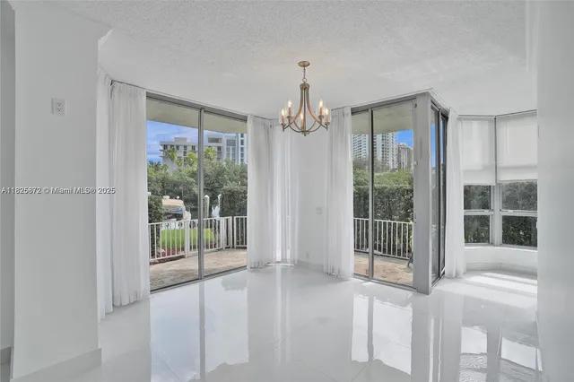 a view of a room with windows and entryway