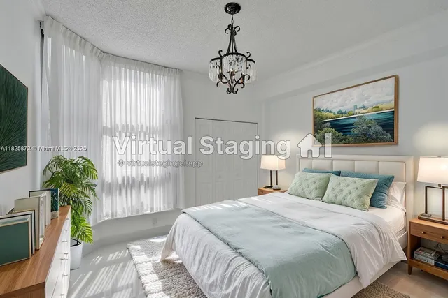 a bedroom with bed and a large window