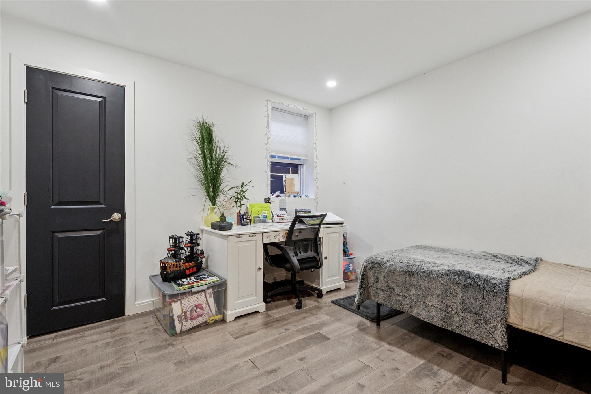 2694 Bridge Street Philadelphia, PA 19137 - Photo 33 of 41 a bedroom with bed and a potted plant