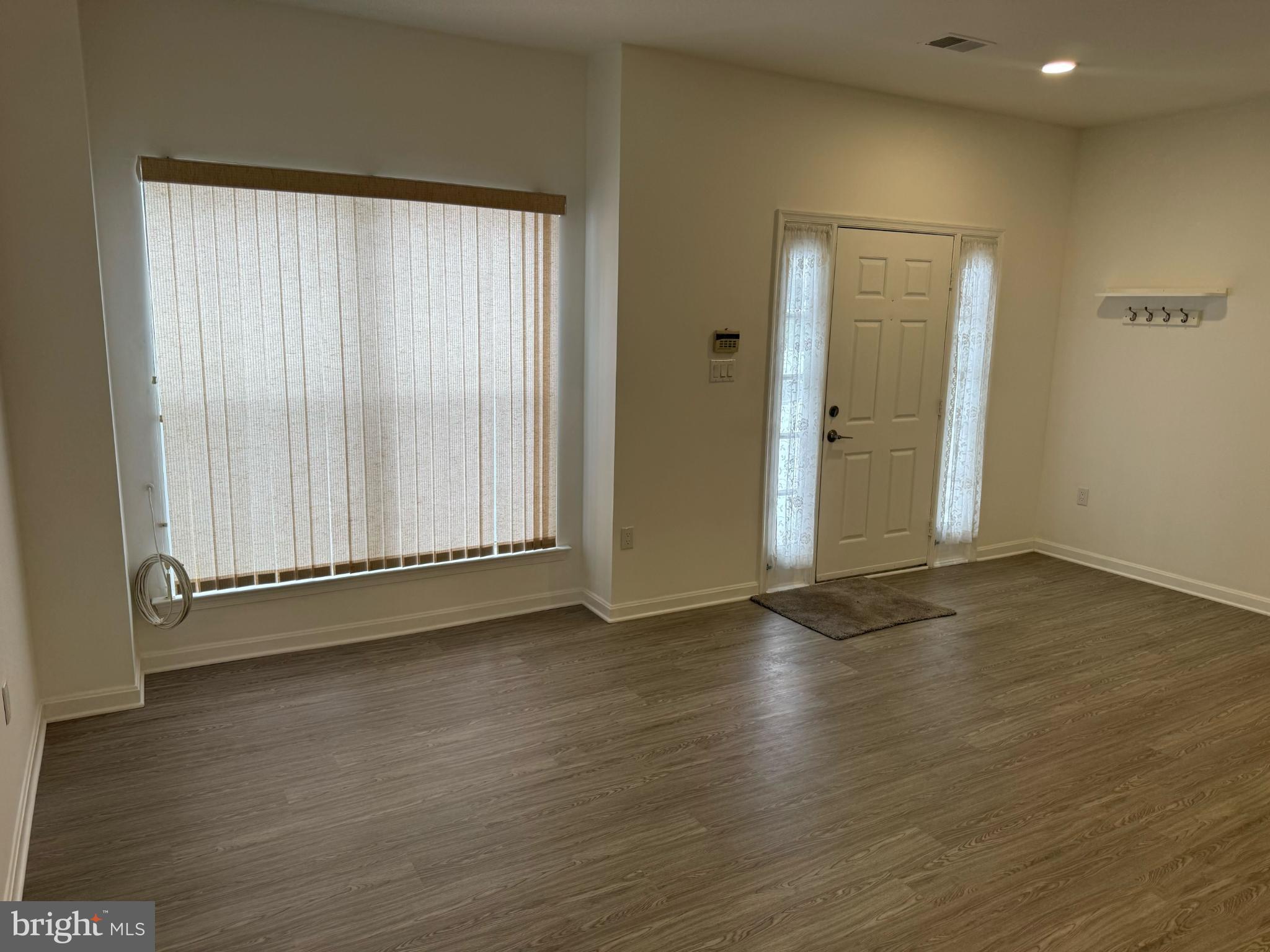 2014 Crosbyside Court Odenton, MD 21113 - Photo 2 of 21 an empty room with wooden floor and windows