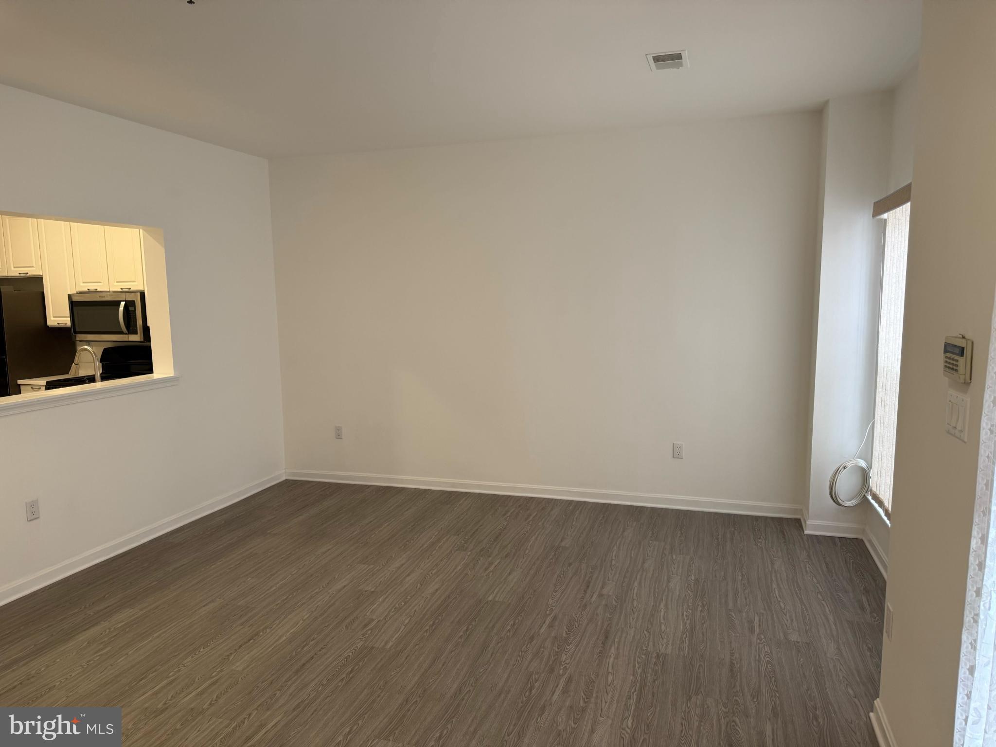 2014 Crosbyside Court Odenton, MD 21113 - Photo 4 of 21 a view of a room with wooden floor and a window