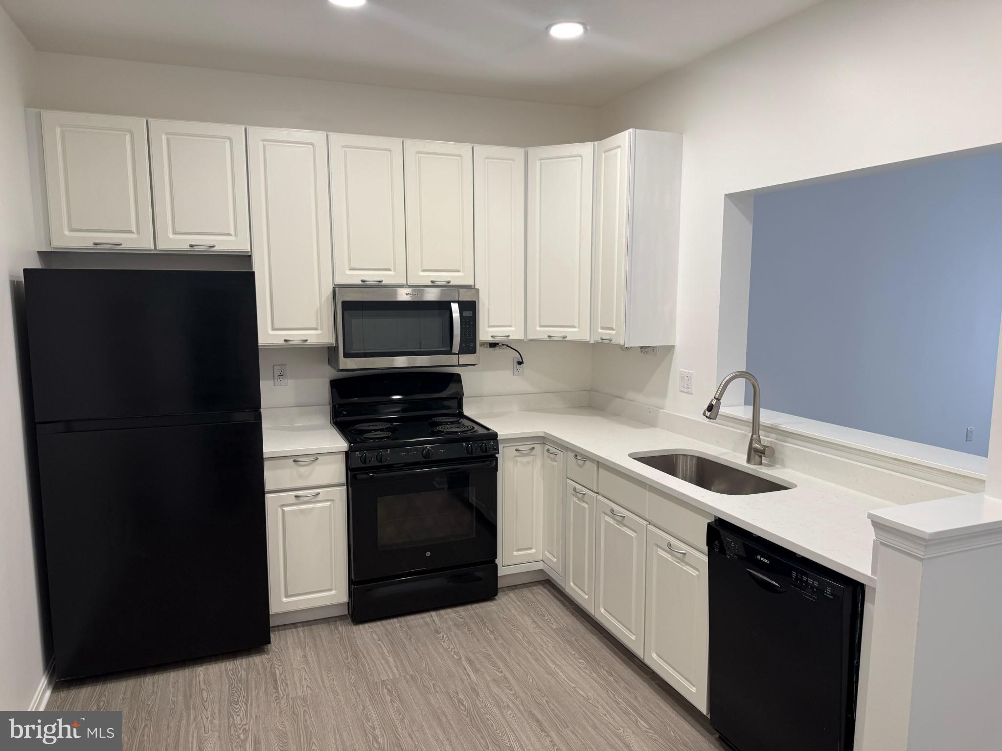 2014 Crosbyside Court Odenton, MD 21113 - Photo 6 of 21 a kitchen with a sink and stainless steel appliances
