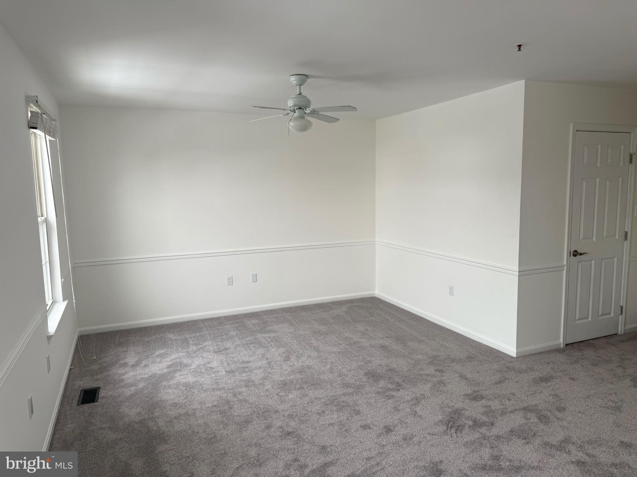 2014 Crosbyside Court Odenton, MD 21113 - Photo 10 of 21 an empty room with a empty space and windows