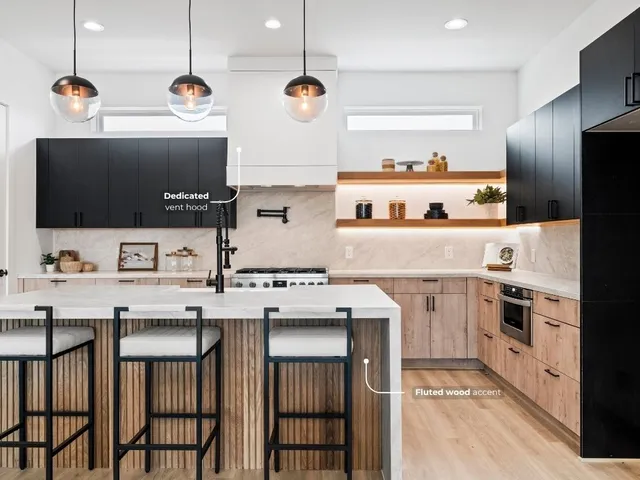 a kitchen with cabinets a sink and appliances