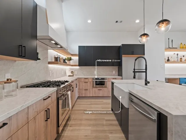 a kitchen with stainless steel appliances granite countertop a sink stove and cabinets