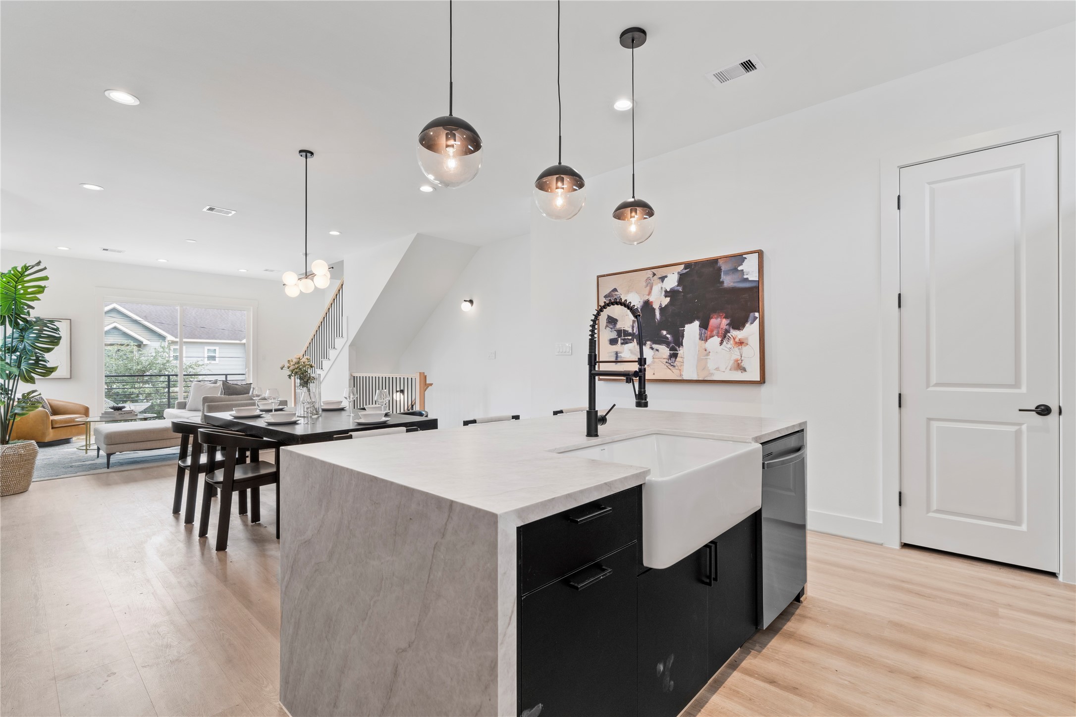 4436 Oats Street Houston, TX 77020 - Photo 19 of 37 a large kitchen with a table and chairs