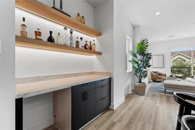 a living room with furniture and potted plant