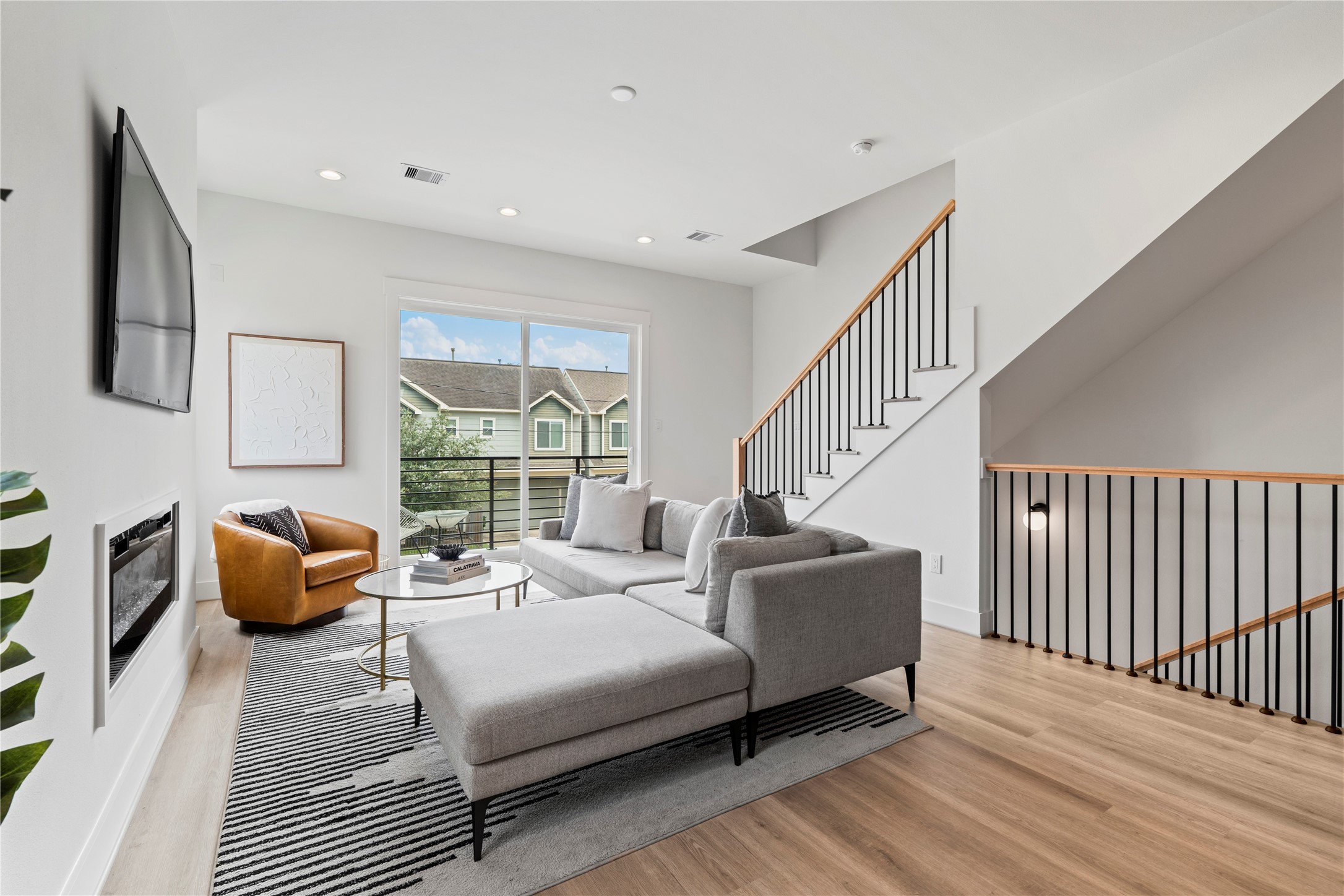 4436 Oats Street Houston, TX 77020 - Photo 21 of 37 a bedroom with furniture and a large window
