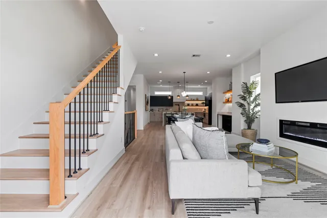 a view of kitchen with furniture and a flat screen tv