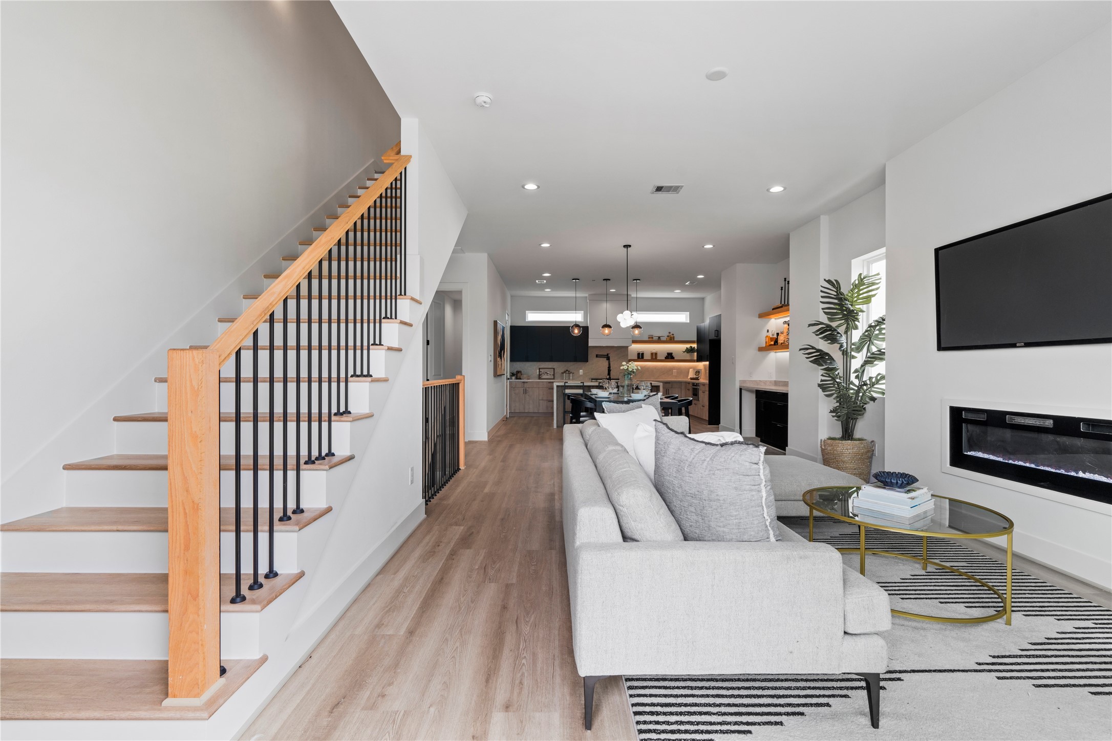 4436 Oats Street Houston, TX 77020 - Photo 25 of 37 a view of kitchen with furniture and a flat screen tv