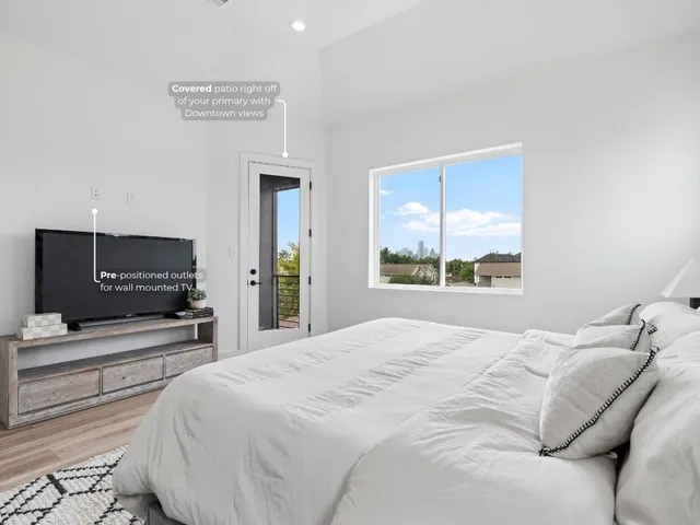 a bedroom with a bed and a television