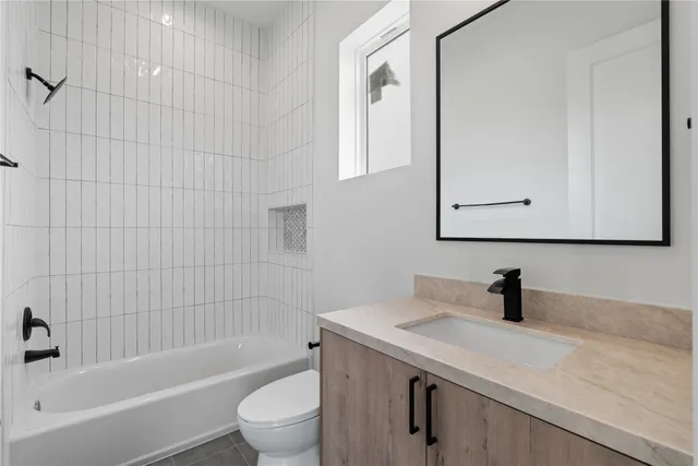 a bathroom with a sink a toilet and a bathtub