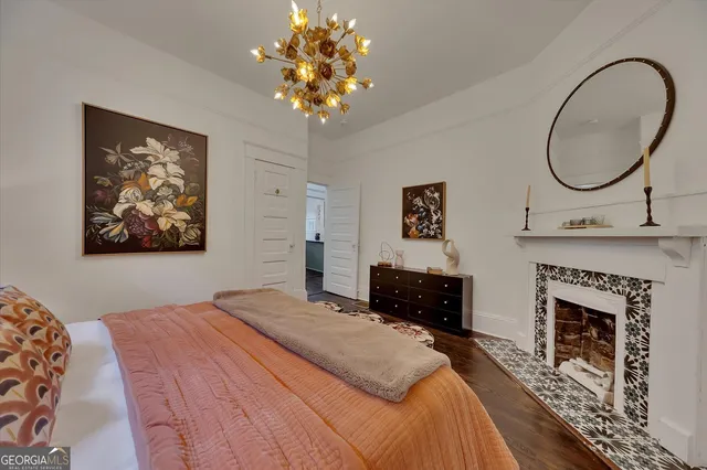 a bedroom with a bed and a fireplace